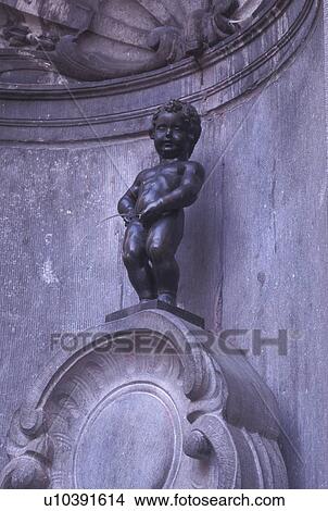 Manneken-Pis, Brussels, Bruxelles, Belgium, Europe, 17th century bronze statue of Mannequin-Pis (Petit Julien) in downtown Brussels. View Large Photo Image Picture - Manneken-Pis, Brussels, Bruxelles, Belgium, Europe, 17th century bronze statue of Mannequin-Pis (Petit Julien) in downtown Brussels.. Fotosearch
