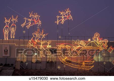 Stock Image -  Marietta, GA, Georgia, Atlanta, Lights of Life Christmas light display of Santa and Reindeer at Life College in Marietta. Fotosearch