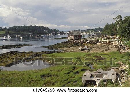 Stock Image -  ME, Maine, Lobster shack at low tide in the harbor of Bayley Island on Casco Bay . Fotosearch