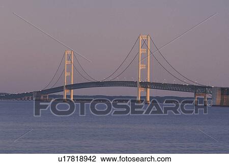 Stock Image -  MI, Mackinac Bridge, Mackinaw City, MI, Michigan, Upper Peninsula, Mackinac Bridge, a suspension span bridge, crosses the Straits of Mackinaw in Mackinaw City connecting the Lower Peninsula with the Upper Peninsula of Michigan.. Fotosearch