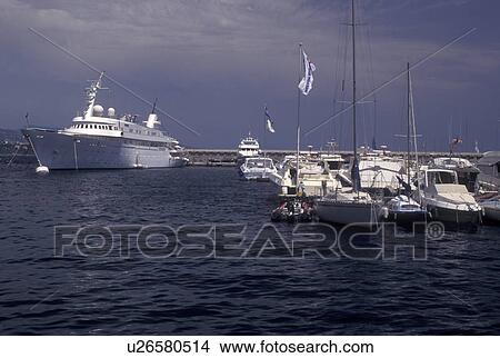 Monaco, Boats docked in Monaco Harbor in the district of La Condamine in the Principality of Monaco along the Mediterranean Sea. View Large Photo Image Picture - Monaco, Boats docked in Monaco Harbor in the district of La Condamine in the Principality of Monaco along the Mediterranean Sea.. Fotosearch