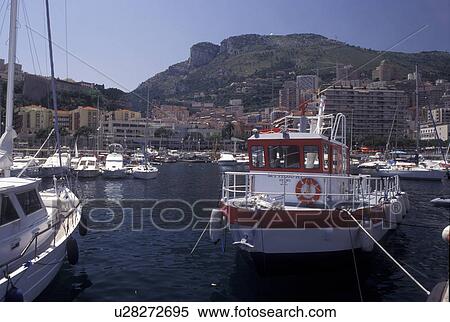 Monaco, Boats docked in Monaco Harbor in the district of La Condamine in the Principality of Monaco along the Mediterranean Sea. View Large Photo Image Stock Photography - Monaco, Boats docked in Monaco Harbor in the district of La Condamine in the Principality of Monaco along the Mediterranean Sea.. Fotosearch