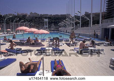 Monaco, Public swimming pool on Monaco Harbor in the district of La Condamine in the Principality of Monaco along the Mediterranean Sea. View Large Photo Image Stock Photo - Monaco, Public swimming pool on Monaco Harbor in the district of La Condamine in the Principality of Monaco along the Mediterranean Sea.. Fotosearch