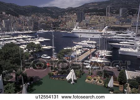 Monaco, View of Monaco Harbor in the district of La Condamine in the Principality of Monaco along the Mediterranean Sea. View Large Photo Image Stock Image - Monaco, View of Monaco Harbor in the district of La Condamine in the Principality of Monaco along the Mediterranean Sea.. Fotosearch