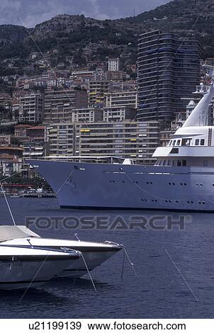 Stock Photo -  Monaco, Yachts docked in Monaco Harbor in the district of La Condamine in the Principality of Monaco along the Mediterranean Sea.. Fotosearch