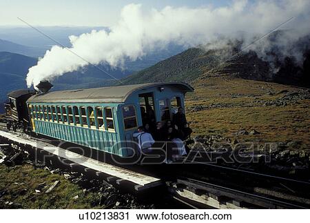 Mount Washington, NH, Breton Woods, White Mountain National Forest, New Hampshire, Mt. Washington Cog Railway train carries passengers to the summit of Mount Washington in the White Mountain Nat'l Forest. View Large Photo Image Stock Image - Mount Washington, NH, Breton Woods, White Mountain National Forest, New Hampshire, Mt. Washington Cog Railway train carries passengers to the summit of Mount Washington in the White Mountain Nat'l Forest.. Fotosearch