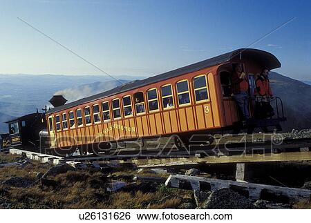 Mount Washington, NH, Breton Woods, White Mountain National Forest, New Hampshire, Mt. Washington Cog Railway train carries passengers to the summit of Mount Washington in the White Mountain Nat'l Forest. View Large Photo Image Stock Photograph - Mount Washington, NH, Breton Woods, White Mountain National Forest, New Hampshire, Mt. Washington Cog Railway train carries passengers to the summit of Mount Washington in the White Mountain Nat'l Forest.. Fotosearch