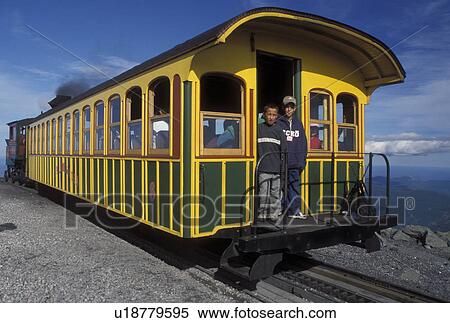 Mount Washington, NH, Breton Woods, White Mountain National Forest, New Hampshire, Mt. Washington Cog Railway train on the summit of Mount Washington in the White Mountain Nat'l Forest. View Large Photo Image Stock Photography - Mount Washington, NH, Breton Woods, White Mountain National Forest, New Hampshire, Mt. Washington Cog Railway train on the summit of Mount Washington in the White Mountain Nat'l Forest.. Fotosearch