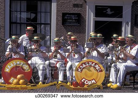 Stock Photo -  musicians, Netherlands, Edam, Holland, Noord-Holland, Europe, The Edam Band plays outside cheese market on market day in the city of Edam.. Fotosearch