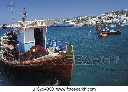 Mykonos, Cyclades, Greek Islands, Greece, Europe, Fishing boats and ferries buoyed in Mykonos Harbor on the Aegean Sea. View Large Photo Image Stock Image - Mykonos, Cyclades, Greek Islands, Greece, Europe, Fishing boats and ferries buoyed in Mykonos Harbor on the Aegean Sea.. Fotosearch