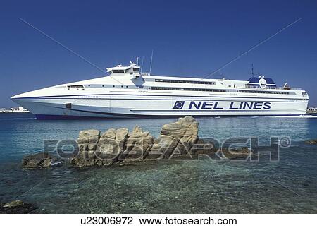 Stock Image -  Mykonos, ferry, Greek Islands, Cyclades, Greece, Europe, Ferry docked in the harbor on Mykonos Island on the Aegean Sea.. Fotosearch