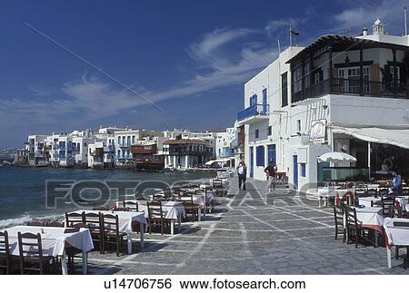 Stock Photograph -  Mykonos, Greek Islands, Cyclades, Greece, Europe, Outdoor cafT at Little Venice along the waterfront of Mykonos on the Aegean Sea.. Fotosearch