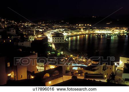 Stock Photograph -  Mykonos, Greek Islands, Cyclades, Greece, Europe, Scenic view of Mykonos Harbor in the evening on the Aegean Sea.. Fotosearch
