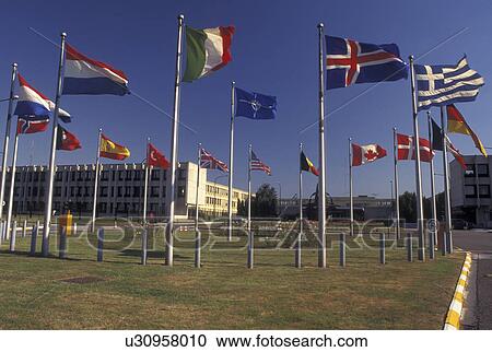 Stock Image -  NATO, Brussels, Bruxelles, Belgium, Europe, Flags of the countries fly outside the North Atlantic Treaty Organization in Brussels. NATO headquarters.. Fotosearch