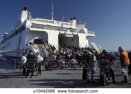 Naxos, Greece, Greek Islands, Cyclades, Europe, Ferry loading passengers in Hora Naxos Harbor on Naxos Island on the Aegean Sea. View Large Photo Image Stock Photograph - Naxos, Greece, Greek Islands, Cyclades, Europe, Ferry loading passengers in Hora Naxos Harbor on Naxos Island on the Aegean Sea.. Fotosearch