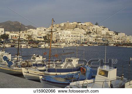 Stock Photograph -  Naxos, Greece, Greek Islands, Cyclades, Europe, Fishing boats docked in Hora Naxos Harbor on Naxos Island on the Aegean Sea.. Fotosearch