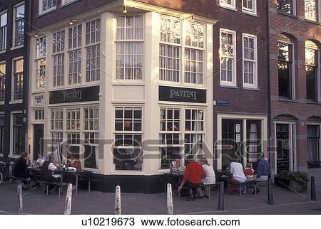 Netherlands, Amsterdam, Holland, Noord-Holland, Europe, Outdoor cafT along a street in downtown Amsterdam. View Large Photo Image Stock Image - Netherlands, Amsterdam, Holland, Noord-Holland, Europe, Outdoor cafT along a street in downtown Amsterdam.. Fotosearch