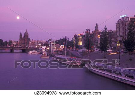 Netherlands, Amsterdam, Holland, Noord-Holland, Europe, Full moon rising over canal in the evening in Amsterdam. View Large Photo Image Stock Photo - Netherlands, Amsterdam, Holland, Noord-Holland, Europe, Full moon rising over canal in the evening in Amsterdam.. Fotosearch