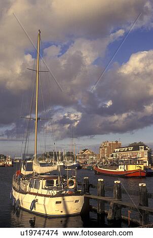 Picture -  Netherlands, Holland, Groningen, Delfzijl, North Sea, Europe, Boats docked along the harbor of Delfzijl on the North Sea.. Fotosearch