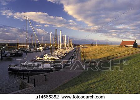 Netherlands, Holland, Groningen, Termunten, Europe, Boats docked in the harbor on the North Sea in Termunten. View Large Photo Image Stock Image - Netherlands, Holland, Groningen, Termunten, Europe, Boats docked in the harbor on the North Sea in Termunten.. Fotosearch