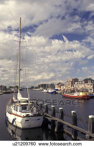 Stock Image -  Netherlands, Holland, Groningen, Delfzijl, North Sea, Europe, Boats docked along the harbor of Delfzijl on the North Sea.. Fotosearch