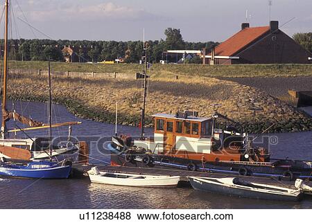 Netherlands, Holland, Groningen, Termunten, Europe, Boats docked in the harbor on the North Sea in Termunten. View Large Photo Image Stock Photo - Netherlands, Holland, Groningen, Termunten, Europe, Boats docked in the harbor on the North Sea in Termunten.. Fotosearch