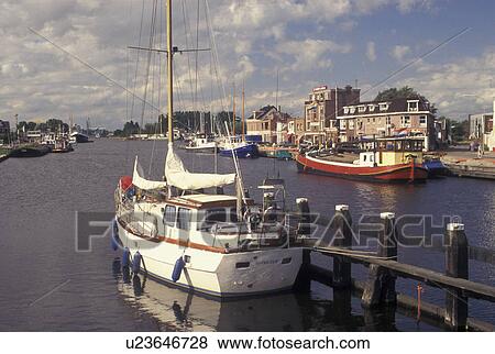 Stock Photo -  Netherlands, Holland, Groningen, Delfzijl, North Sea, Europe, Boats docked along the harbor of Delfzijl on the North Sea.. Fotosearch