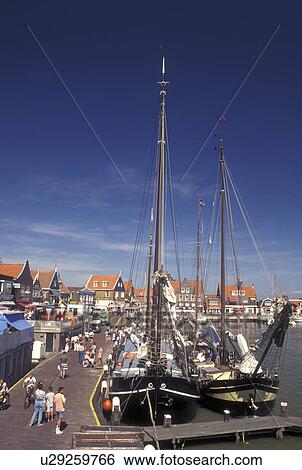 Stock Photograph -  Netherlands, Holland, Volendam, Noord-Holland, Europe, Waterfront on the harbor on Markermeer in the town of Volendam.. Fotosearch