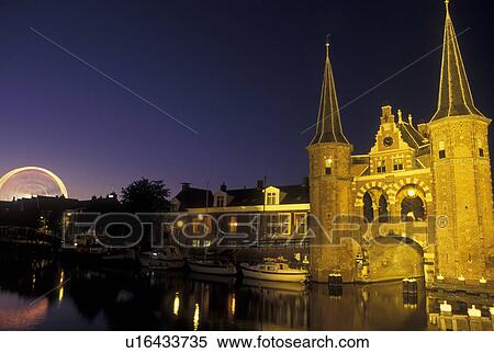 Netherlands, Sneek, Holland, Friesland, Europe, Water Tower (1613) along the canal in downtown Sneek illuminated at night. View Large Photo Image Stock Photography - Netherlands, Sneek, Holland, Friesland, Europe, Water Tower (1613) along the canal in downtown Sneek illuminated at night.. Fotosearch