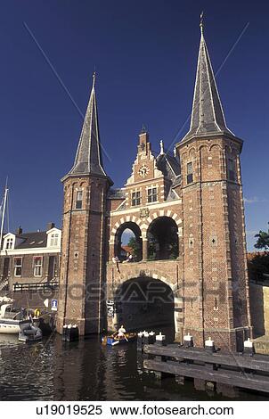 Stock Photography -  Netherlands, Sneek, Holland, Friesland, Europe, Water Tower (1613) along the canal in downtown Sneek.. Fotosearch