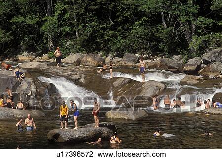 NH, New Hampshire, White Mountain National Forest, People swimming at a swimming hole on the Swift River along the Scenic Kancamagus Highway in the White Mountain Nat'l Forest. View Large Photo Image Stock Image - NH, New Hampshire, White Mountain National Forest, People swimming at a swimming hole on the Swift River along the Scenic Kancamagus Highway in the White Mountain Nat'l Forest.. Fotosearch