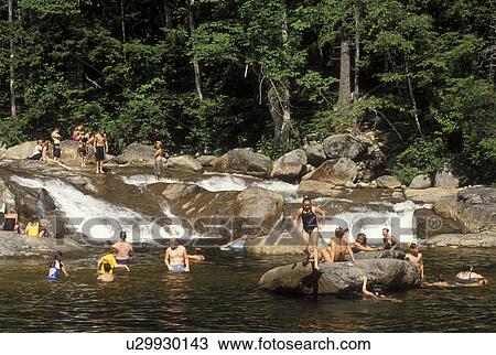 NH, New Hampshire, White Mountain National Forest, People swimming at a swimming hole on the Swift River along the Scenic Kancamagus Highway in the White Mountain Nat'l Forest. View Large Photo Image Stock Image - NH, New Hampshire, White Mountain National Forest, People swimming at a swimming hole on the Swift River along the Scenic Kancamagus Highway in the White Mountain Nat'l Forest.. Fotosearch
