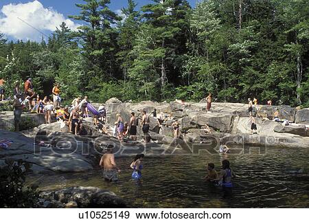 NH, New Hampshire, White Mountain National Forest, People swimming at a swimming hole on the Swift River along the Scenic Kancamagus Highway in the White Mountain Nat'l Forest. View Large Photo Image Stock Photo - NH, New Hampshire, White Mountain National Forest, People swimming at a swimming hole on the Swift River along the Scenic Kancamagus Highway in the White Mountain Nat'l Forest.. Fotosearch