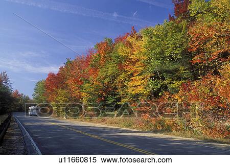 Stock Photography -  NH, road, New Hampshire, White Mountain National Forest, Merrimack River Valley, Scenic Kancamagus Highway surrounded by colorful fall foliage in the autumn in the White Mountain Nat'l Forest.. Fotosearch