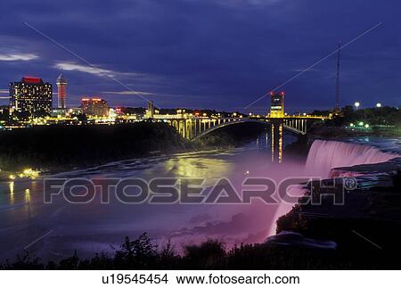 Picture -  Niagara Falls, Canada/USA, Ontario, NY, New York, Niagara River, Illumination at the American Falls at Niagara Falls at night.. Fotosearch