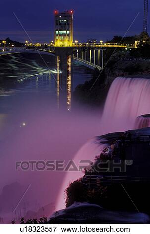 Niagara Falls, Canada/USA, Ontario, NY, New York, Niagara River, Illumination at the American Falls at Niagara Falls at night. View Large Photo Image Stock Photo - Niagara Falls, Canada/USA, Ontario, NY, New York, Niagara River, Illumination at the American Falls at Niagara Falls at night.. Fotosearch