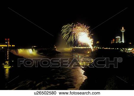 Stock Image -  Niagara Falls, fireworks, Canada/USA, Ontario, NY, New York, Niagara River, Firework display over Niagara Falls at night.. Fotosearch