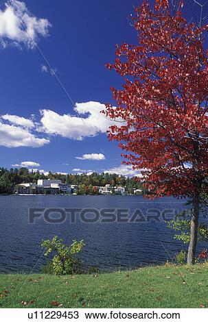 NY, Lake Placid, New York, The Adirondacks, Scenic view of the resort town of Lake Placid and Mirror Lake in the autumn. View Large Photo Image Stock Image - NY, Lake Placid, New York, The Adirondacks, Scenic view of the resort town of Lake Placid and Mirror Lake in the autumn.. Fotosearch