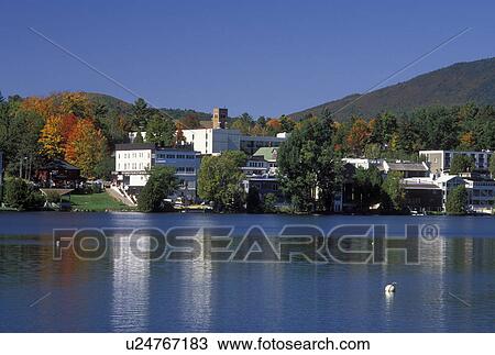 NY, Lake Placid, The Adirondacks, New York, Scenic view of the resort town of Lake Placid along Mirror Lake in the autumn. View Large Photo Image Stock Image - NY, Lake Placid, The Adirondacks, New York, Scenic view of the resort town of Lake Placid along Mirror Lake in the autumn.. Fotosearch