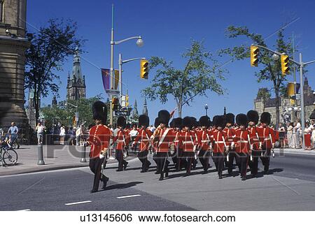 Ottawa, Ontario, Canada, Marching band marches down Elgin Street during the Changing of the Guard ceremony on Parliament Hill in the capital city of Ottawa. View Large Photo Image Stock Photograph - Ottawa, Ontario, Canada, Marching band marches down Elgin Street during the Changing of the Guard ceremony on Parliament Hill in the capital city of Ottawa.. Fotosearch