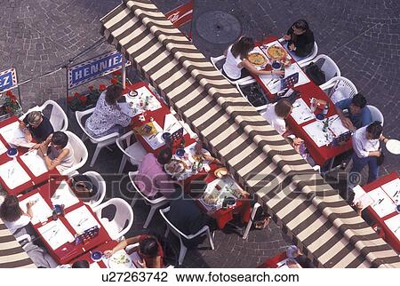 Stock Image -  outdoor cafT, aerial, Geneva, Switzerland, Looking down at people eating at an outdoor cafT in the old town of the city of Geneva.. Fotosearch