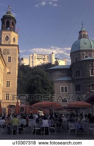 Stock Photo -  outdoor cafT, Austria, Salzburg, Outdoor cafT at Mozartplatz in the city of Salzburg.. Fotosearch