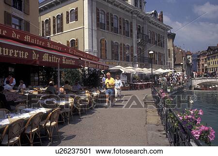 outdoor cafT, France, Annecy, Haute-Savoie, Rhone-Alpes, Europe, Outdoor cafes along the Thiou canal in the old town of Annecy.  View Large Photo Image Stock Image -  outdoor cafT, France, Annecy, Haute-Savoie, Rhone-Alpes, Europe, Outdoor cafes along the Thiou canal in the old town of Annecy. . Fotosearch