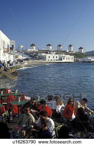 outdoor cafT, Greece, Mykonos, Greek Islands, Cyclades, Europe, Outdoor cafT at Little Venice along the waterfront of Mykonos on the Aegean Sea. View Large Photo Image Stock Image - outdoor cafT, Greece, Mykonos, Greek Islands, Cyclades, Europe, Outdoor cafT at Little Venice along the waterfront of Mykonos on the Aegean Sea.. Fotosearch