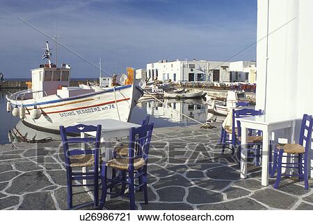 outdoor cafT, Greece, Paros, Naoussa, Greek Islands, Cyclades, Europe, Outdoor cafT on the waterfront on Naoussa Harbor on Paros Island on the Aegean Sea. View Large Photo Image Stock Image - outdoor cafT, Greece, Paros, Naoussa, Greek Islands, Cyclades, Europe, Outdoor cafT on the waterfront on Naoussa Harbor on Paros Island on the Aegean Sea.. Fotosearch