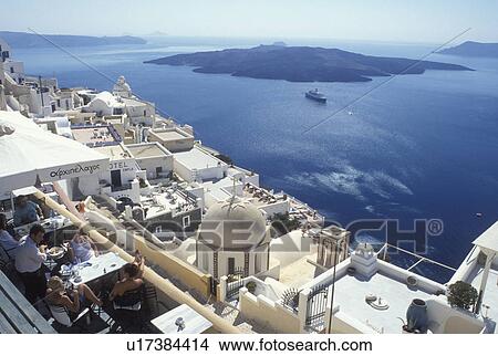 outdoor cafT, Greece, Santorini, Greek Islands, Fira, Cyclades, Europe, Outdoor restaurant in the village of Fira on the steep hillside of Santorini Island overlooking the Aegean Sea. View Large Photo Image Picture - outdoor cafT, Greece, Santorini, Greek Islands, Fira, Cyclades, Europe, Outdoor restaurant in the village of Fira on the steep hillside of Santorini Island overlooking the Aegean Sea.. Fotosearch