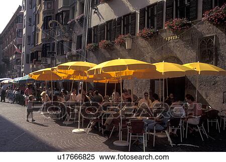Stock Photography -  outdoor cafT, Innsbruck, Austria, Tirol, Outdoor cafes along a cobbled pedestrian street in the city of Innsbruck.. Fotosearch