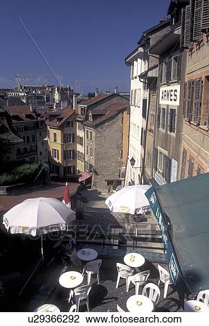 Stock Image -  outdoor cafT, Lausanne, Switzerland, Vaud, Outdoor cafT on a narrow steep street in downtown Lausanne.. Fotosearch