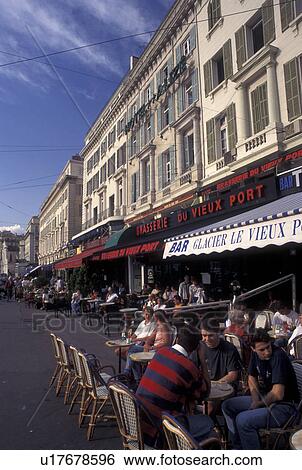 outdoor cafT, Marseille, France, Provence, Cote d' Azur, Bouche-du-Rhone, Marseilles, Europe, People sitting at outdoor cafTs along Quai des Belges on the waterfront of Vieux Port in the city of Marseille on the Mediterranean Sea. View Large Photo Image Stock Photograph - outdoor cafT, Marseille, France, Provence, Cote d' Azur, Bouche-du-Rhone, Marseilles, Europe, People sitting at outdoor cafTs along Quai des Belges on the waterfront of Vieux Port in the city of Marseille on the Mediterranean Sea.. Fotosearch