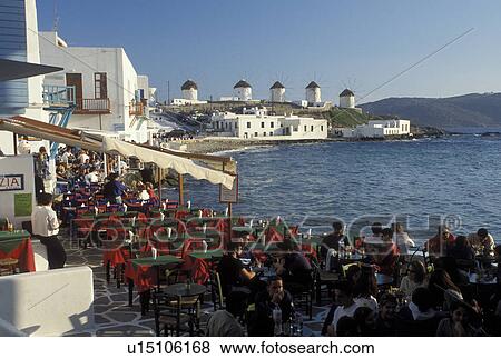 outdoor cafT, Mykonos, Greece, Greek Islands, Cyclades, Europe, Outdoor cafT at Little Venice along the waterfront of Mykonos on the Aegean Sea. View Large Photo Image Stock Photo - outdoor cafT, Mykonos, Greece, Greek Islands, Cyclades, Europe, Outdoor cafT at Little Venice along the waterfront of Mykonos on the Aegean Sea.. Fotosearch